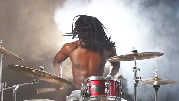Portrait of Active African Man Playing on Drums Set in Music Studio alt