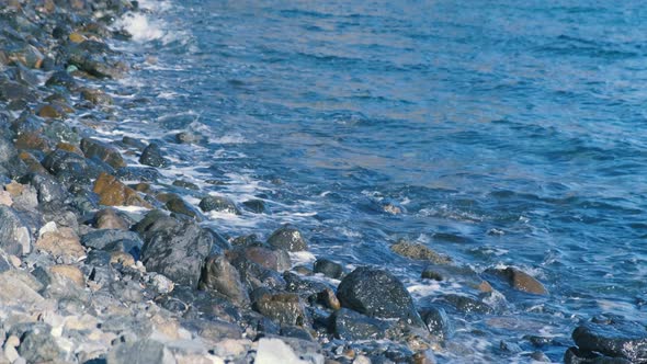 Beach Sea Stones and Small Mountain