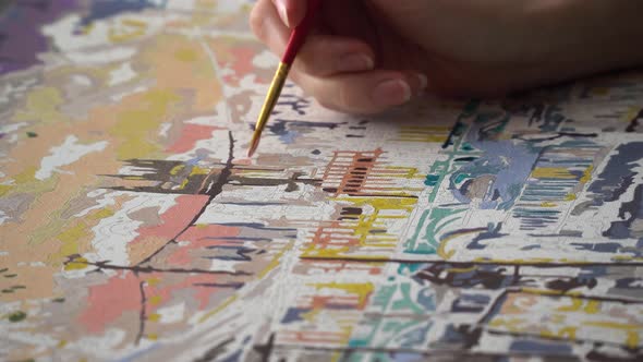 Girl Draws City On Paper