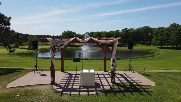 A drone footage of an outdoor event area with a pond in Alexandria, Minnesota, the USA