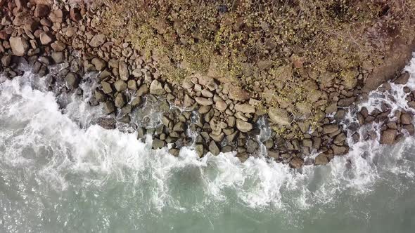 Aerial rotating look down big splash wave alt