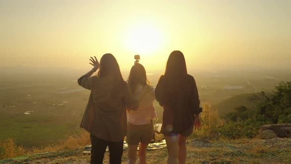 girl friend group Asians blogger standing and caper enjoying the beauty of nature