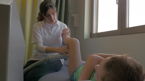 Boy taking physiotherapy treatment alt