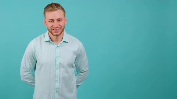 Portrait of Satisfied Bearded Man Doing Thumbs Up Gesture alt