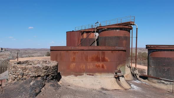 Rusty water tanks from old mine alt