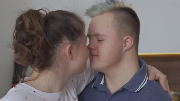 Closeup of Young Couple with Down Syndrome In Love