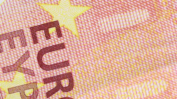 ten euro bill surface detail of printed letters rotating, macro shot. Extreme close up, very close v alt