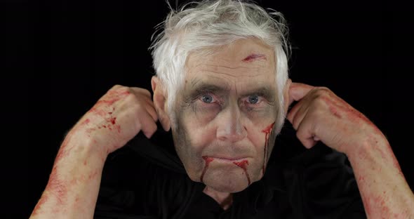 Old Executioner Halloween Makeup and Costume. Elderly Man with Blood on His Face alt