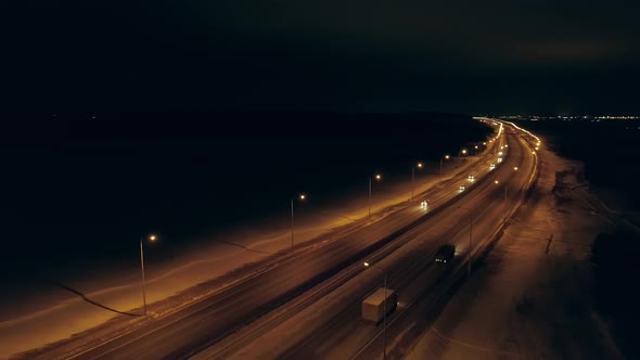 Aerial view of winter night highway with orange lanterns 02 alt