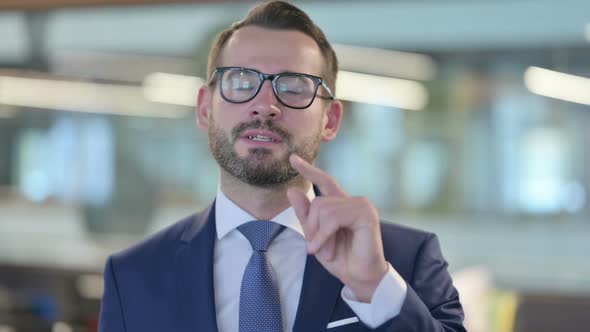 Portrait of Online Video Call By Middle Aged Businessman alt