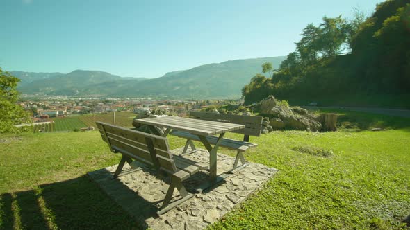 Green Meadow with Benches with Table with Rovereto View alt