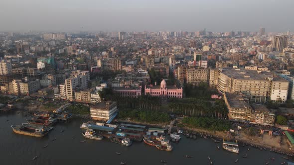 Aerial View Of Pink Ahsan Manzil Museum Near Banks Of Buriganga River in Dhaka. Dolly Forward alt