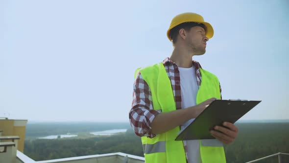 Manager Helmet and Safety Jacket Checking Construction Results Holding Documents