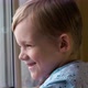 Happy Of Smiling Little Boy is Looking On Window - VideoHive Item for Sale