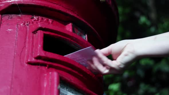 Posting Letter Into English Red Postbox