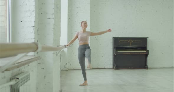 Ballerina Practicing Grand Battement Exercise alt