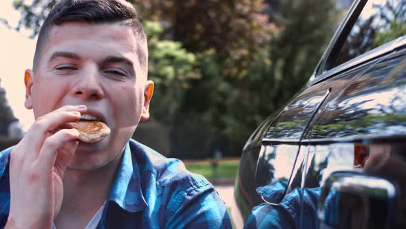 Male Car Expert with Vitiligo Making Review of a Car for Audience Interested in Automobiles alt