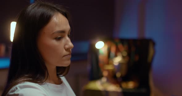 Portrait Beautiful Woman Artist Paints in the Studio Dark Light alt