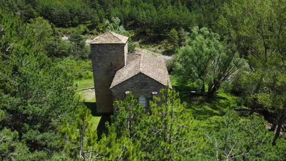 Circular view from a drone of a mountain church alt
