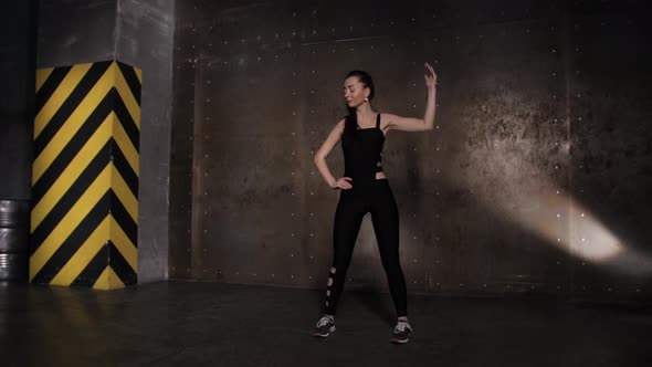 Athlete Performs Exercises From the Group Program with Dumbbells. alt