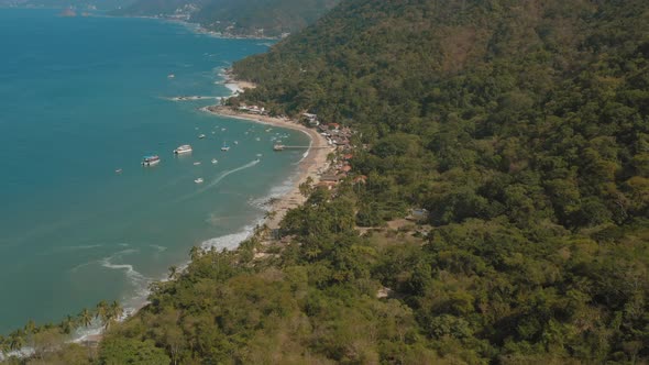 Aerial view of Boca de Tomatlan, Mexican coastline with waves