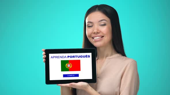 Female Holding Tablet With Learn Portuguese Application, Ready to Start Course alt