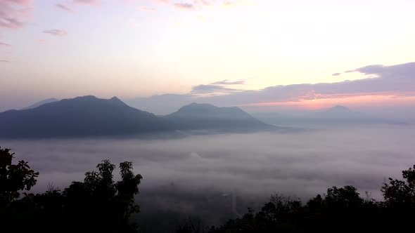 View of the misty landscape with morning sunrise , Time lapse