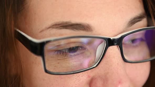 Portrait of Woman in Glasses Looking at the Camera and Smiling Cheerfuly. Close Up