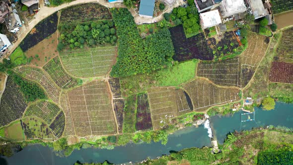 Aerial of the rock formations and towns along the Li River in China alt