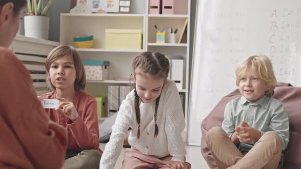 Kids Playing Games with Speech Therapist during Lesson alt