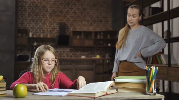 Caring Mother Scolding Her Daughter for Bad Grades alt