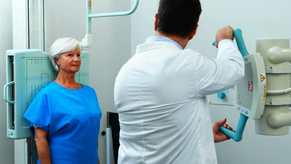 Senior woman undergoing an x-ray test alt
