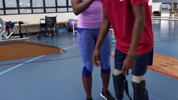 Man exercising with prosthetic legs alt