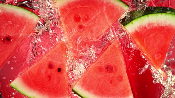 Super Slow Motion Shot of Splashing Fresh Melon Cuts Into Water at 1000 Fps alt
