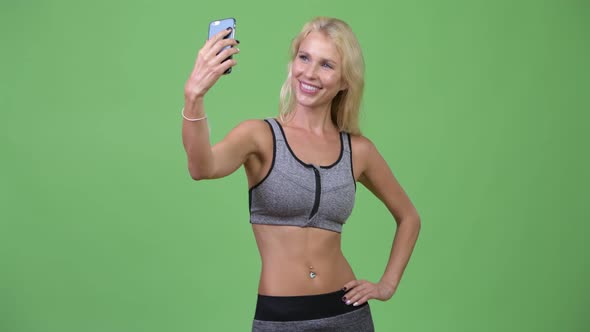 Young Happy Beautiful Woman Taking Selfie Ready for Gym