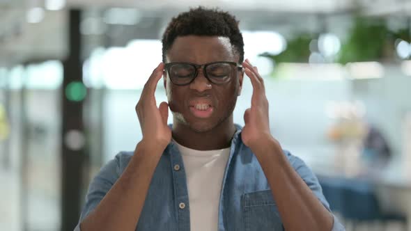 Portrait of Young African Man Having Headache alt