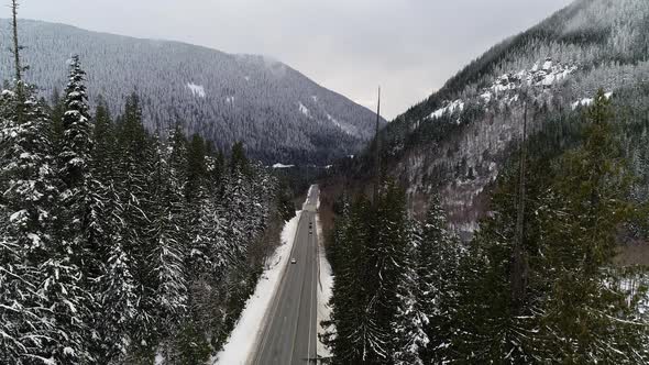 Treetop Frost Forest View Suv Vehicle Driving Down Snowy Mountain Highway alt