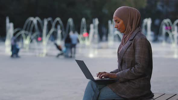 Busy Successful Muslim Student Girl in Hijab Young Islamic Business Woman Using Laptop App Working alt