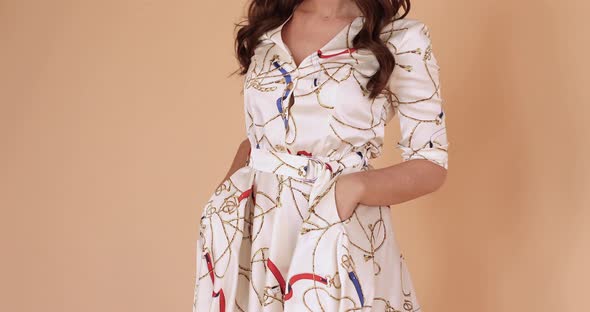 Girl in While Light Dress and Twirling Around in Studio alt