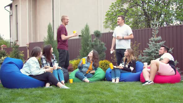 Friends Having Picnic in a Garden