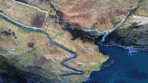 Drone shot looking at the man made steps Whaligoe cliffs in Scotland UK alt