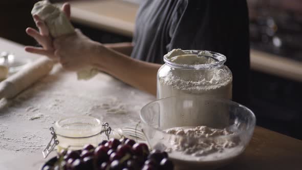 Young Woman in Grey Tshirt Hands Prepare Dough