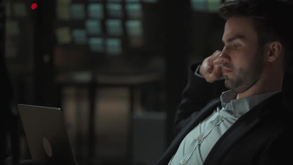 Workaholic at Work Office Manager Works Late a Tired Man with a Laptop on His Lap Works Overtime alt