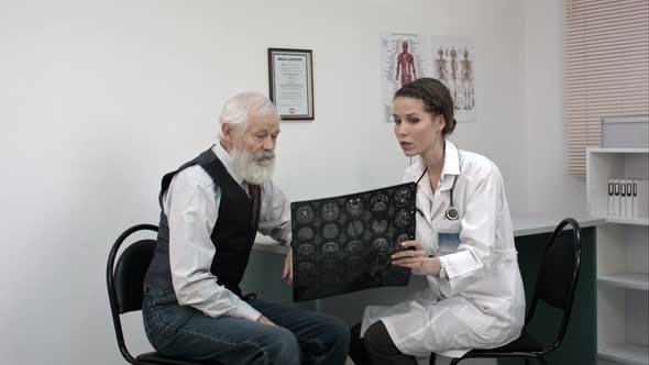 Doctor Explaining X-ray Results