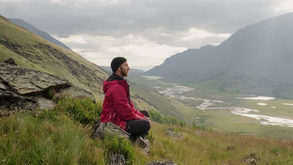 Hiker Tourist Man Travelling Mountains. Explore Adventure Travel Concept. Hiking Man Tourist alt