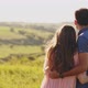 Young Couple Standing in the Nature on Sunset, Looking Somewhere in the Distance Pointing To It - VideoHive Item for Sale