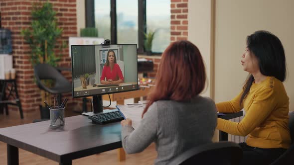 Team of Asian Women Using Video Conference Call for Job Interview alt