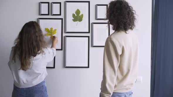 Couple Use Tree Leaves for Wall Decoration