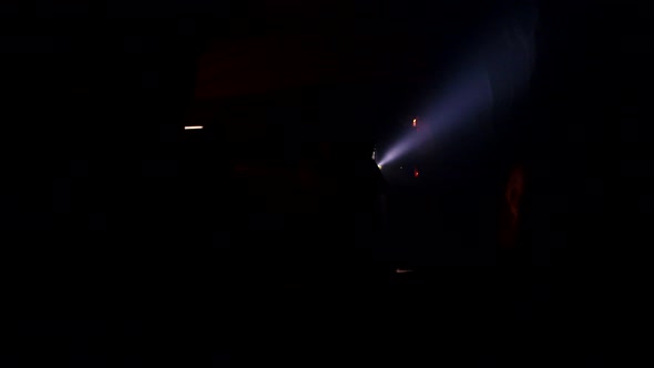 Rescue forces search for survivers inside a dark tunnel using flashlights alt