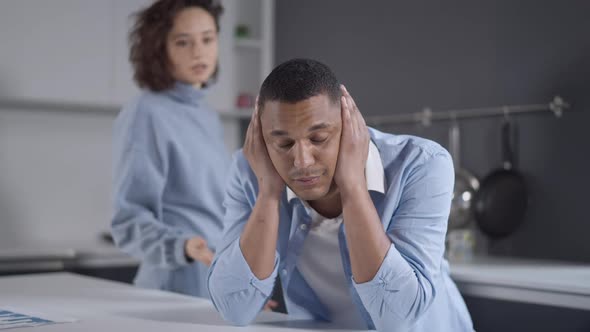 Portrait of Young Handsome African American Man with Closed Ears Looking at Camera As Angry alt